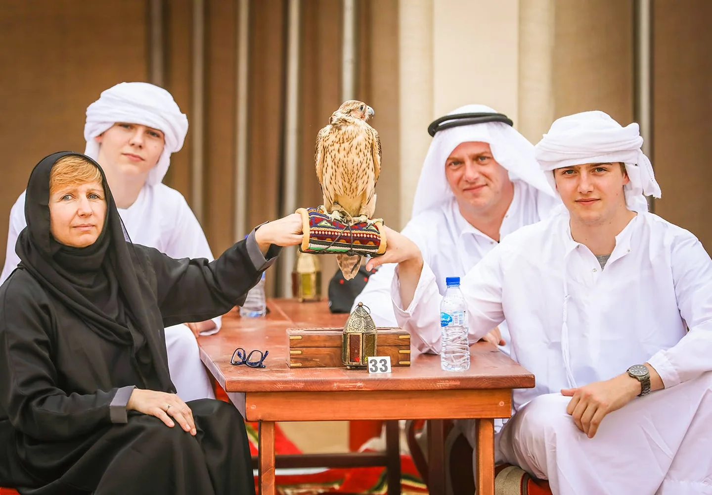 Guests seated for Arabic coffee at a desert camp