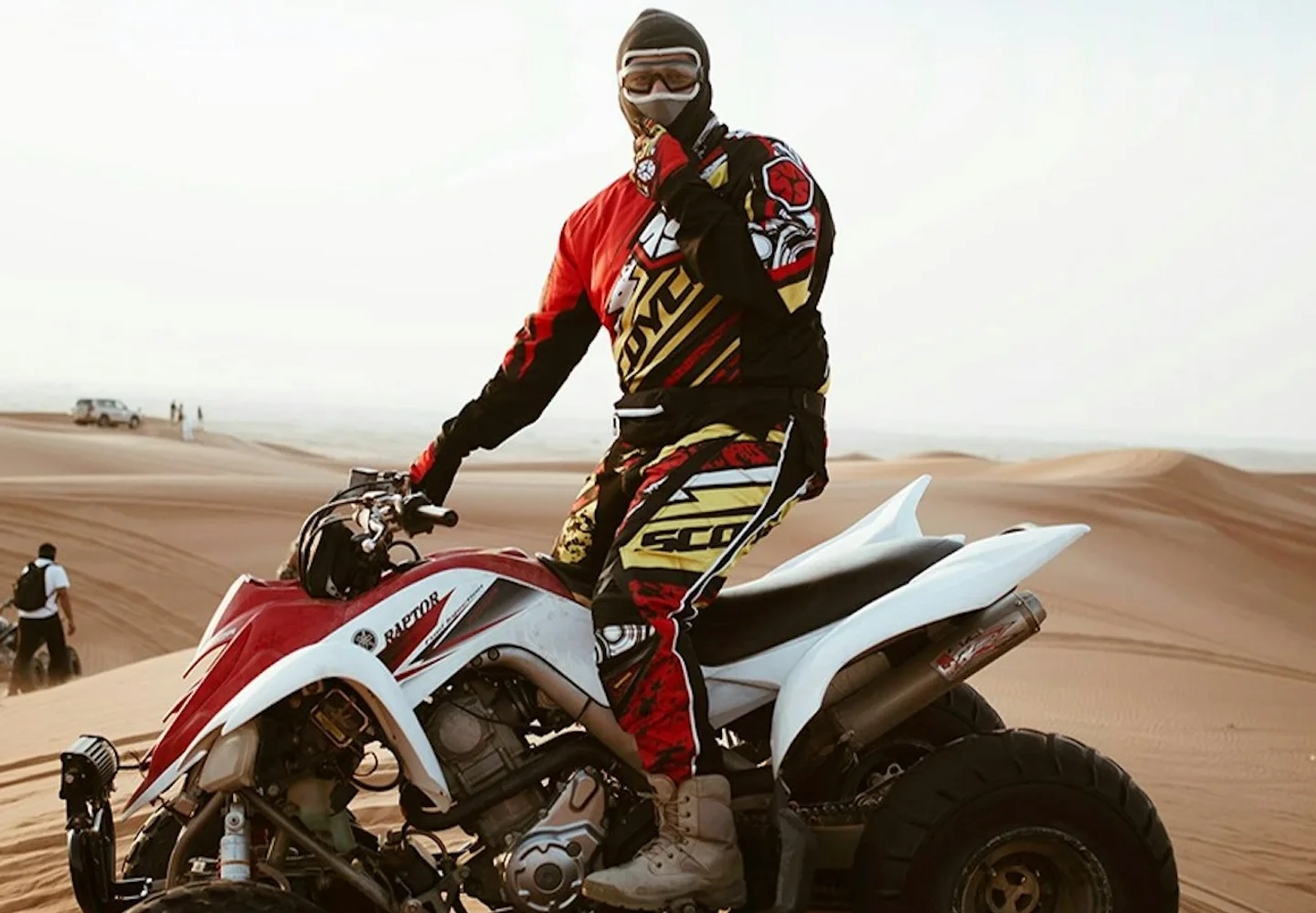 Rider on a white quad bike in the desert